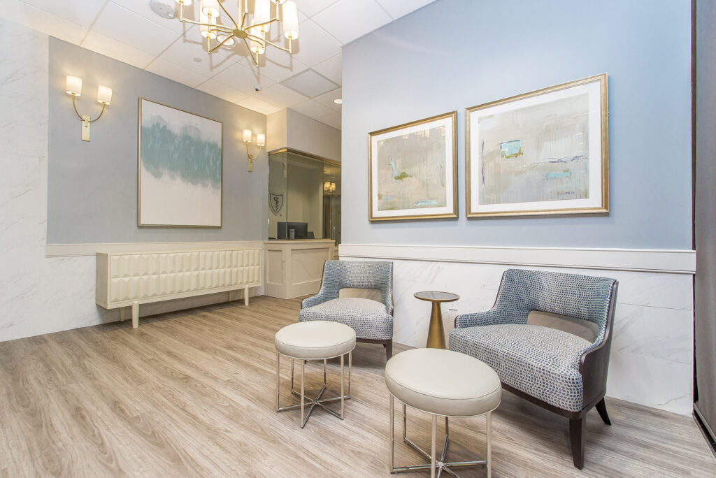 An elegant pastel-and-gold waiting room in Orleans Tower on Poydras St. in New Orleans, LA.