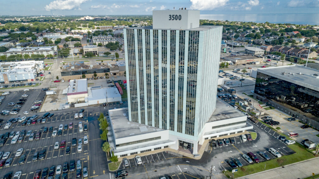An aerial view of Executive Tower at 3500 N Causeway Blvd in Metairie, LA on a sunny day.