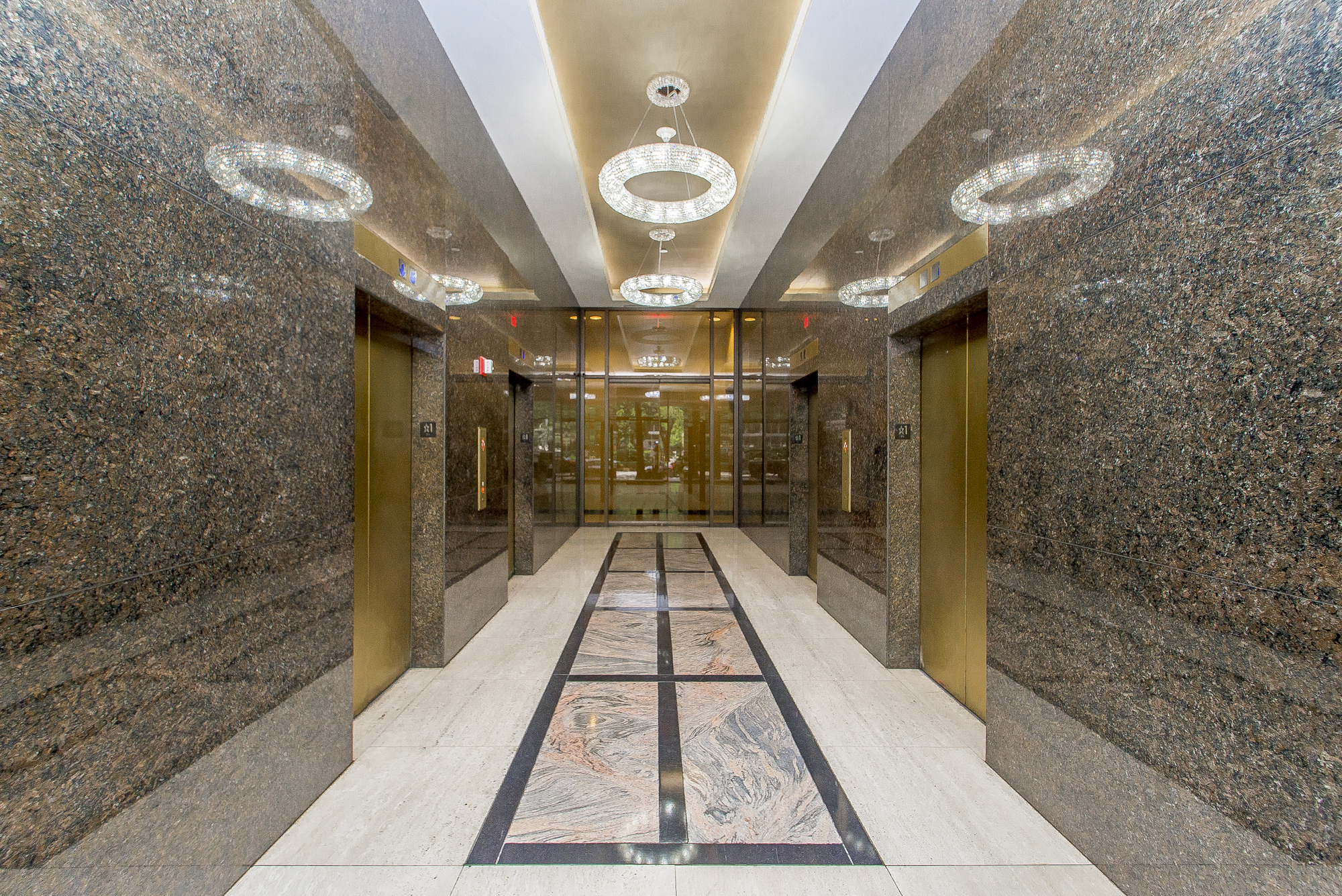 The marble lobby and gold elevators in Orleans Tower on Poydras St. in New Orleans, LA.