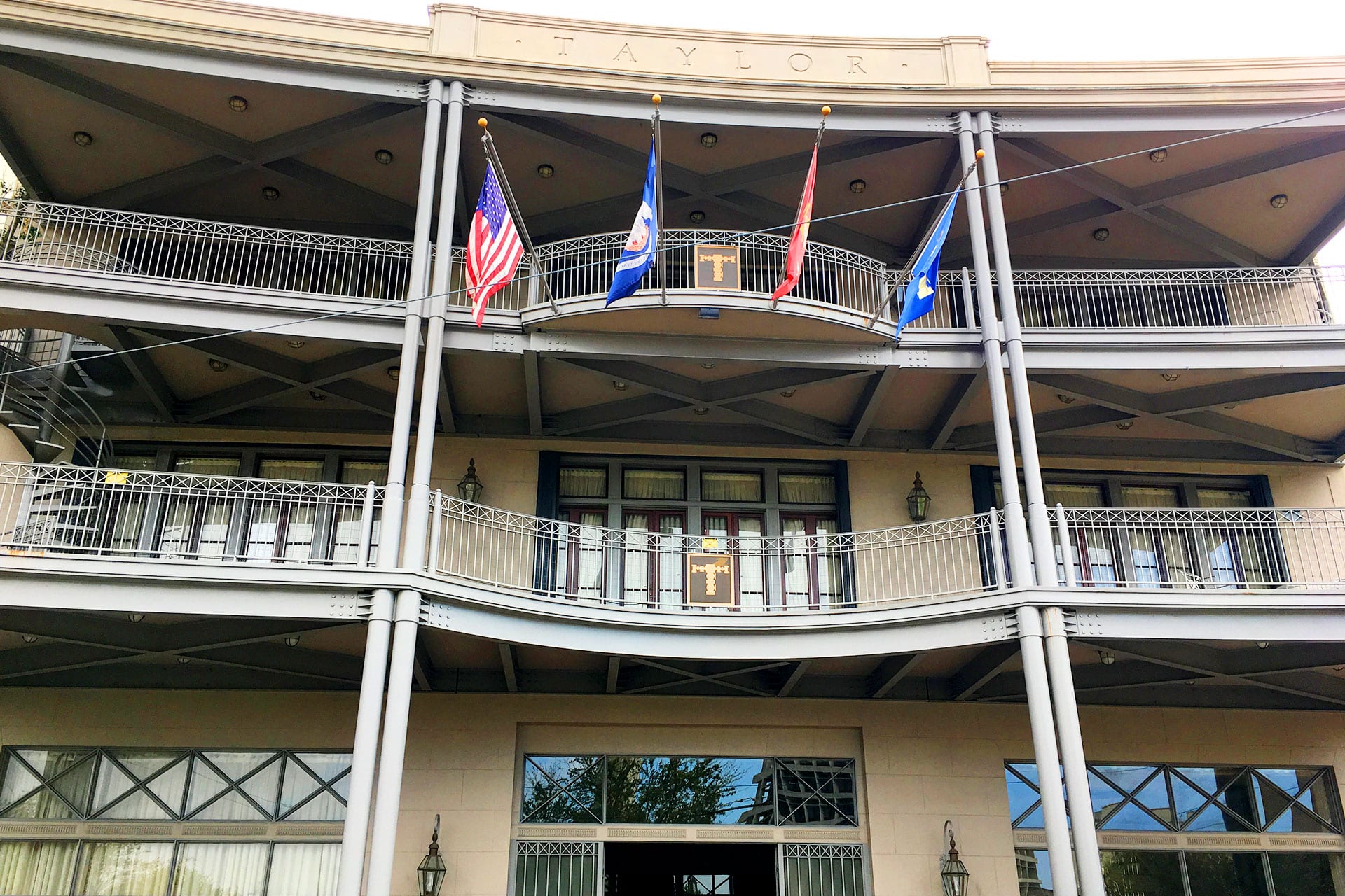 Flags flying in front of the historic Endeavor Enterprises office building in New Orleans, LA.